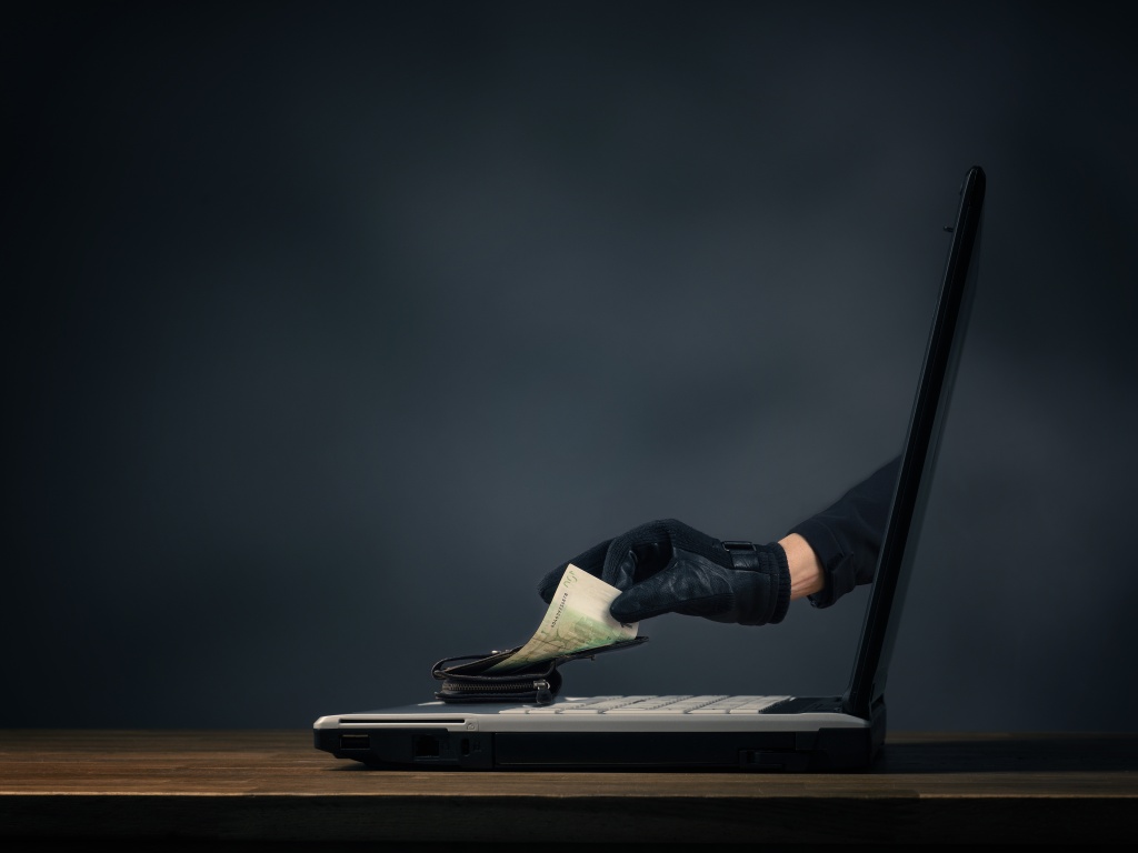 digital-composite-image-thief-stealing-money-from-purse-through-laptop-table.jpg деньги